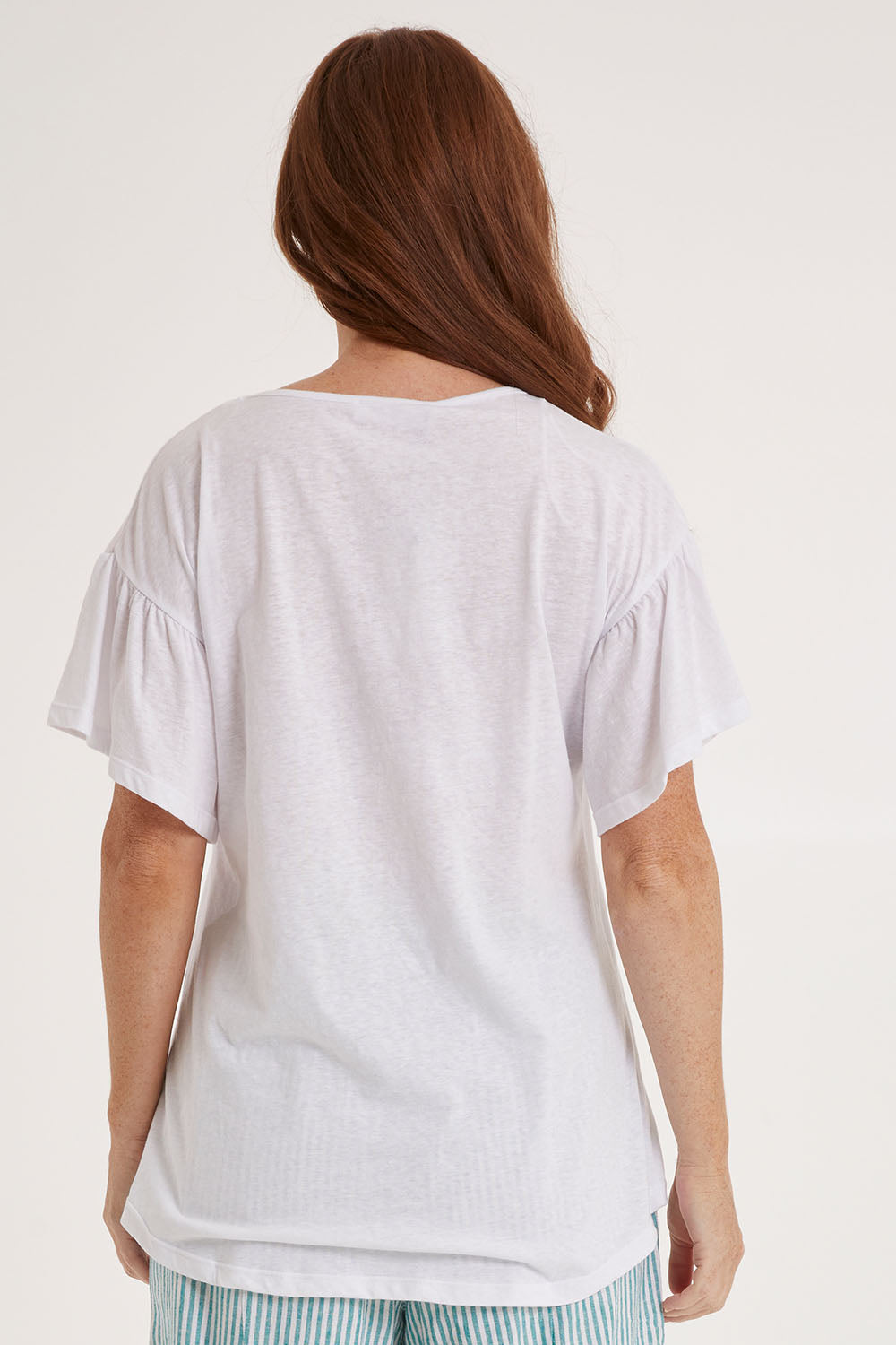 Model Sally wearing size 10 of the Alessi Frill Top in colour White (White), from the back
