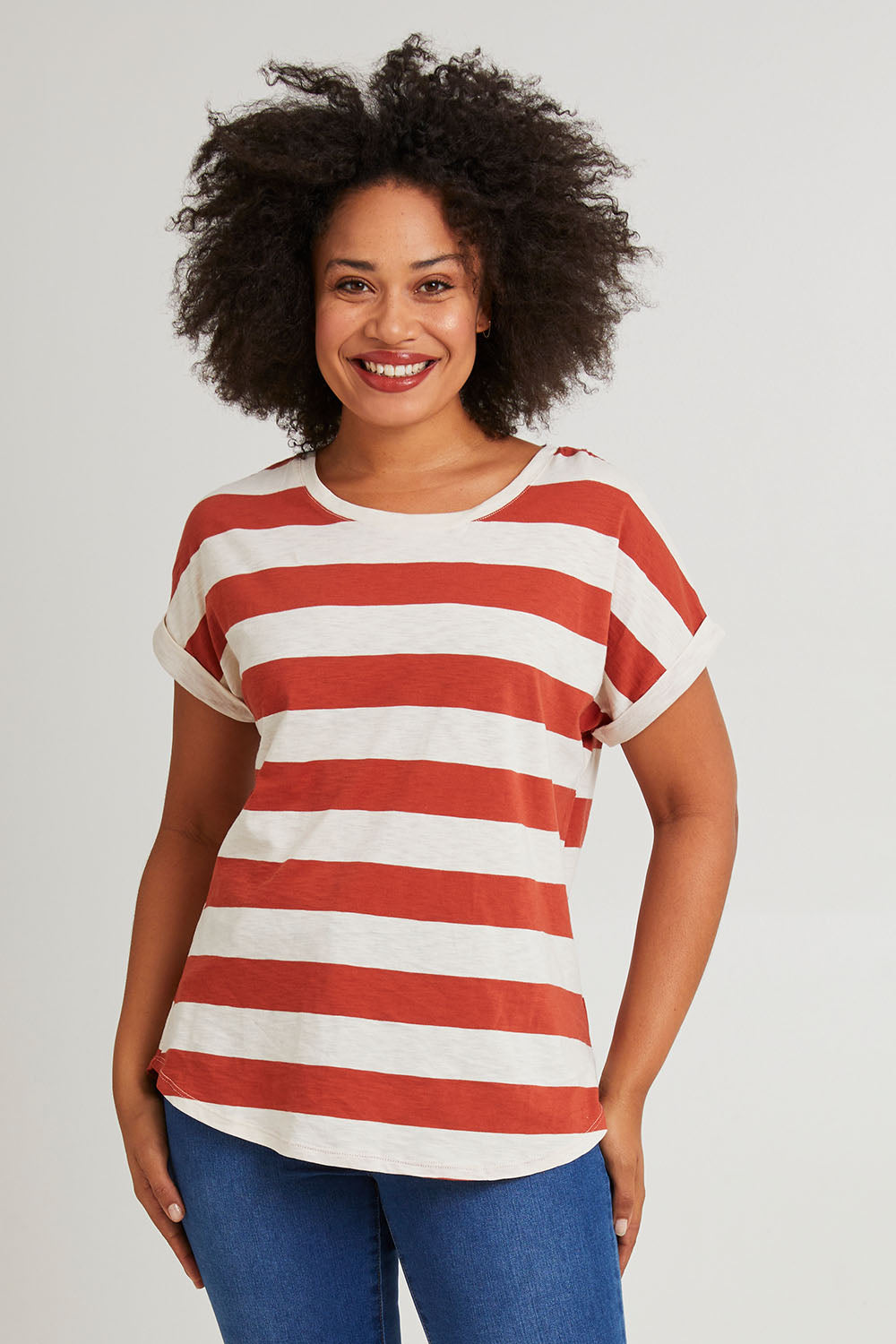Model Olivia wearing size 10 of the Hailey Short Sleeve Tee in colour Terracotta, from the front, cropped image