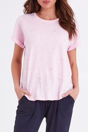 Model Madeline wearing size 10 of the Hailey Short Sleeve Tee in colour Candypine (Pink), from the front, cropped image