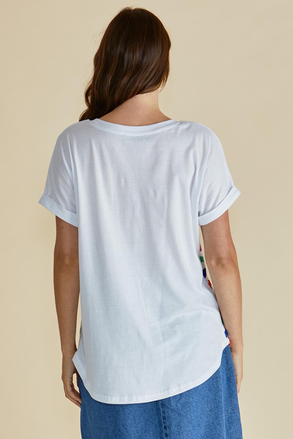 A model wearing the Hailey Short Sleeve Cotton Tee in colour Rainbow, from the back