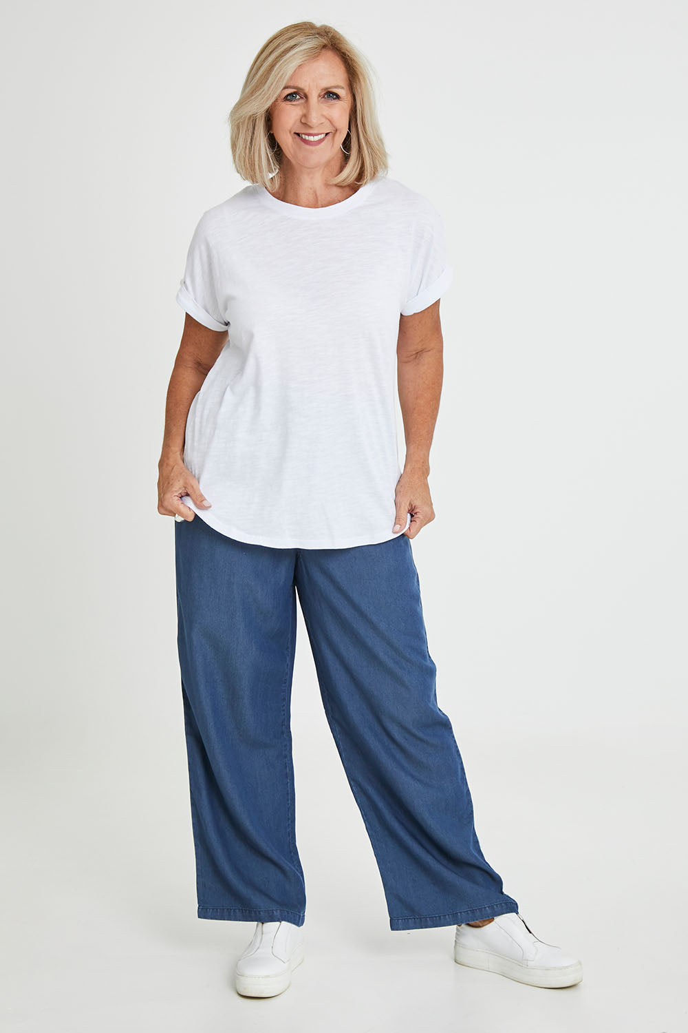 Model Sandy wearing size 10 of the Hailey Short Sleeve Cotton Tee in colour White (White), from the front, showing the whole outfit