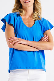 A model wearing the Magnolia Cotton Frill Sleeve Top in colour Powderblue (Blue), from the front, cropped image