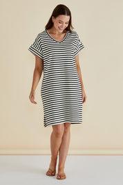 A model wearing the Elise V Neck Cotton Rib Dress in colour Whiteblk, from the front, showing the whole outfit