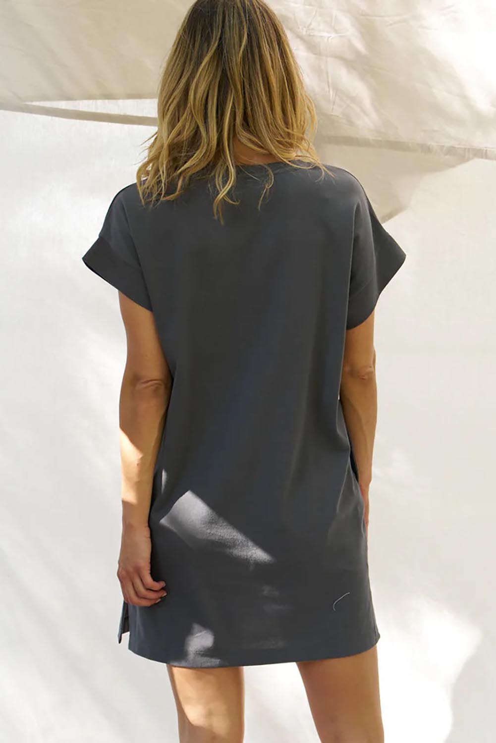 A model wearing the Elise Cotton Vin colourNeck Rib Dress - Steel (Grey), from the back