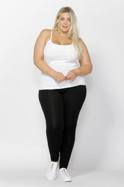 A model wearing the Christina Legging in colour Black (Black), from the front, showing the whole outfit