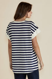 A model wearing the Willa Cotton Tee in colour Navystripe (Blue), from the back