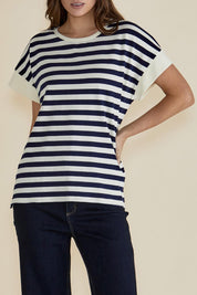 A model wearing the Willa Cotton Tee in colour Navystripe (Blue), from the front, cropped image