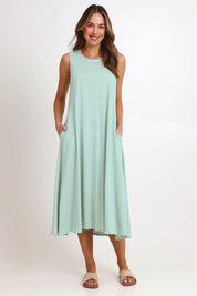 Model Madelinec wearing size 10 of the Sabrina Maxi Dress – Green in colour Green, from the front