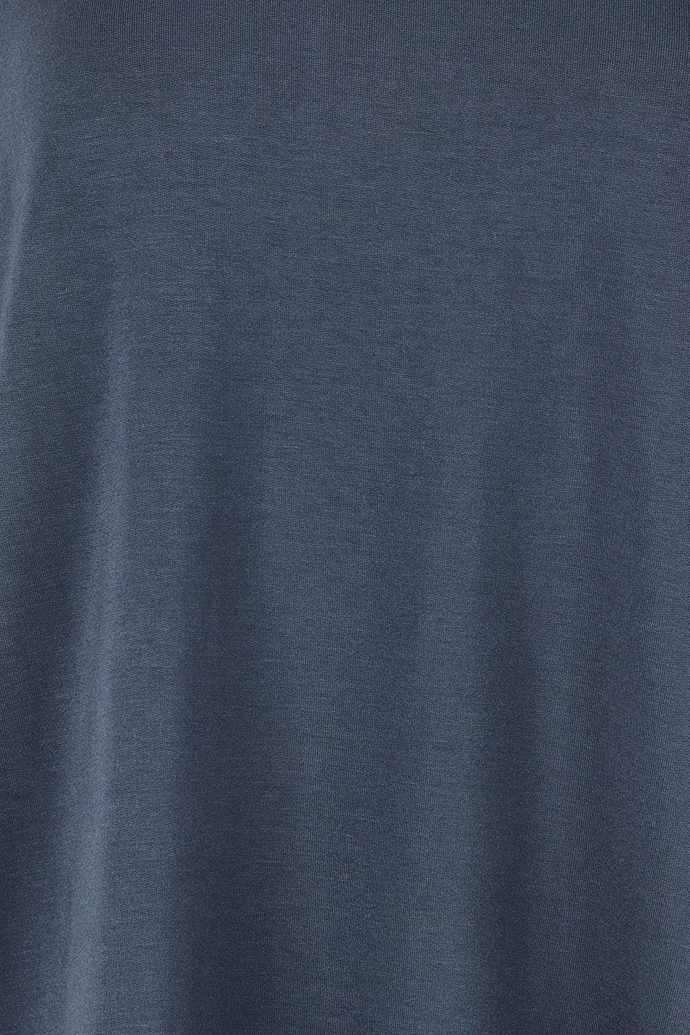 Product shot of the Clara Tee in colour Petrol (Blue), detail