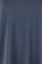 Product shot of the Clara Tee in colour Petrol (Blue), detail