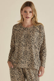 A model wearing the Brixley Long Sleeve Cotton Top in colour Leopard, from the front, cropped image
