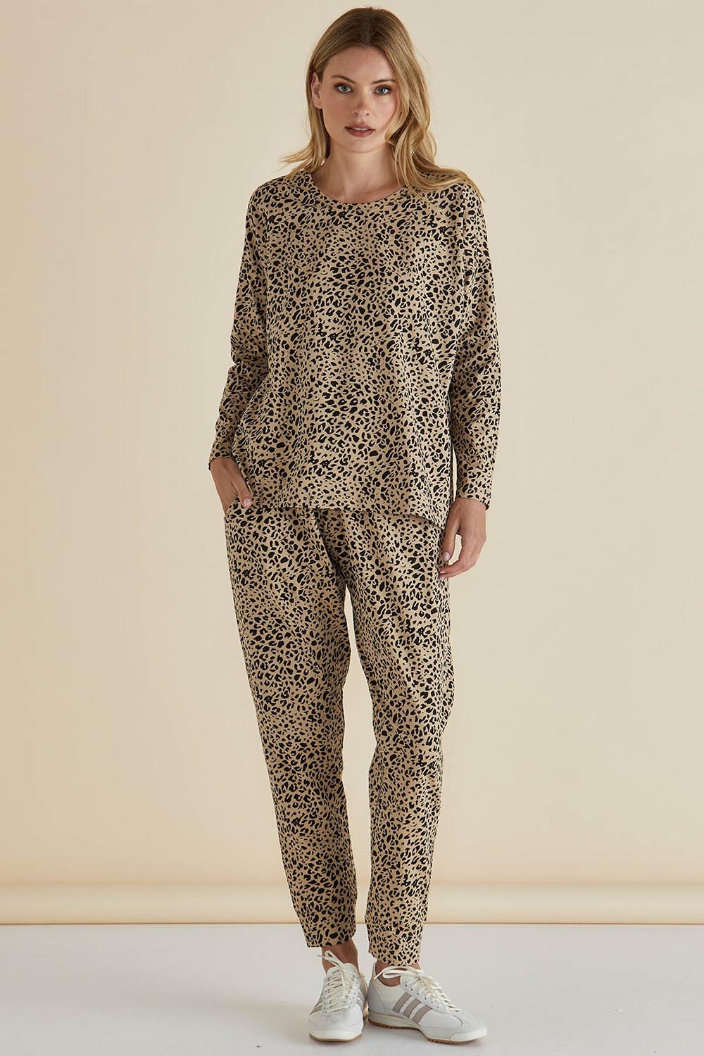 A model wearing the Brixley Long Sleeve Cotton Top in colour Leopard, from the front, showing the whole outfit