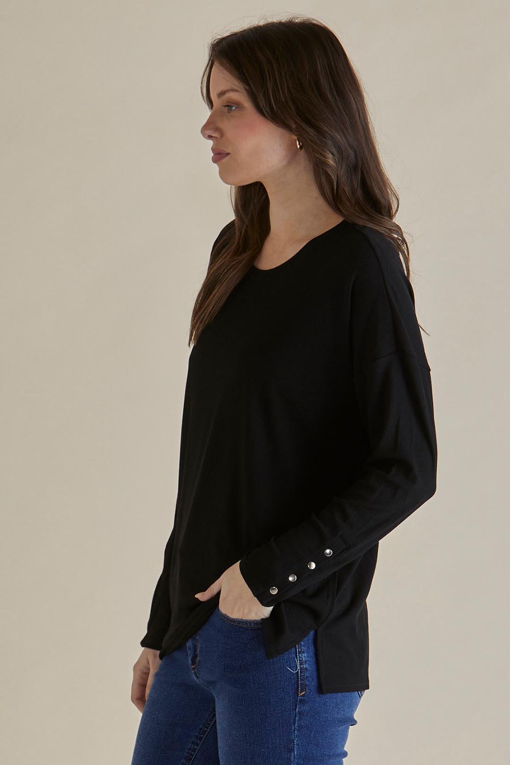 A model wearing the Hendrix Ribbed Long Sleeve Tee in colour Black (Black), from the front, cropped image