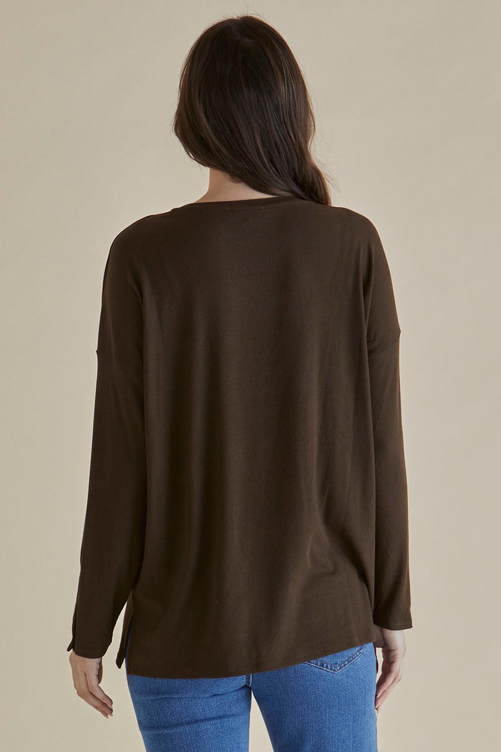 A model wearing the Hendrix Ribbed Long Sleeve Tee in colour Brown, from the back