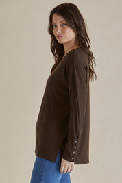 A model wearing the Hendrix Ribbed Long Sleeve Tee in colour Brown, from the front, cropped image