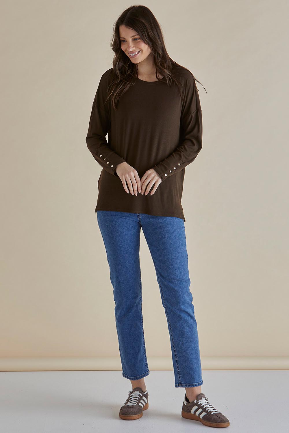 A model wearing the Hendrix Ribbed Long Sleeve Tee in colour Brown, from the front, showing the whole outfit