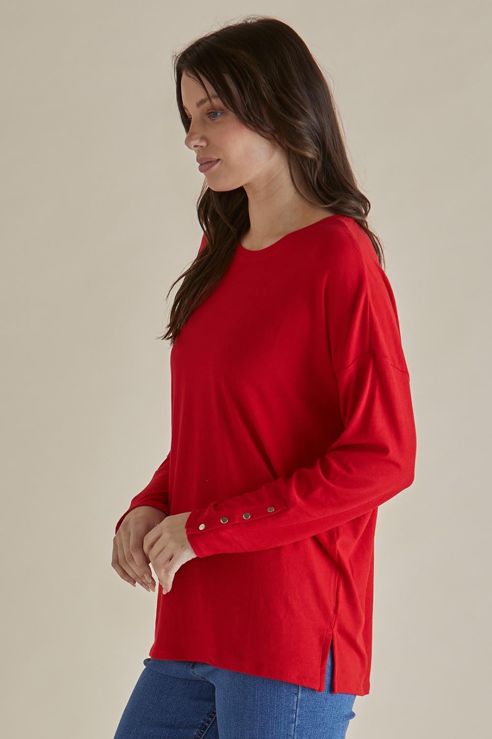 A model wearing the Hendrix Ribbed Long Sleeve Tee in colour Red (Red), from the front, cropped image
