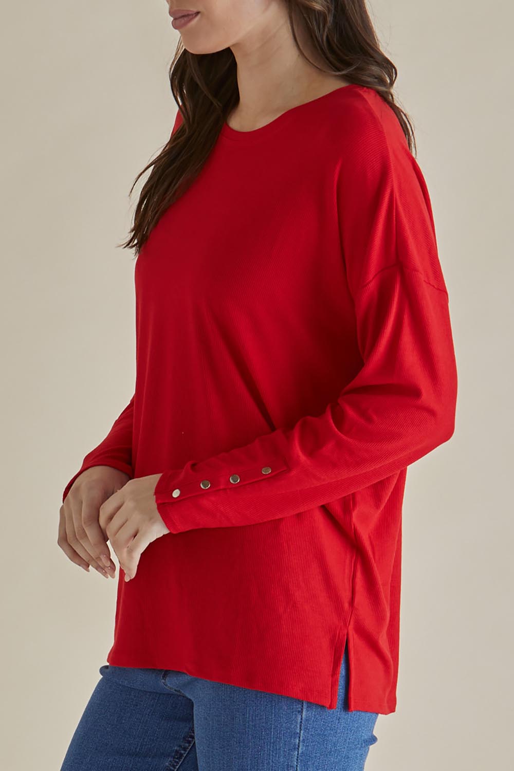 A model wearing the Hendrix Ribbed Long Sleeve Tee in colour Red (Red), from the front, cropped image