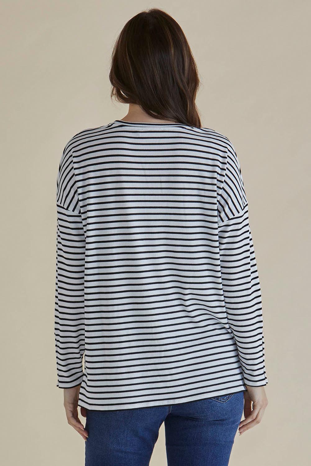 A model wearing the Hendrix Ribbed Long Sleeve Tee in colour Stripe (White), from the back