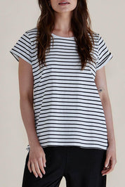 A model wearing the Caia Cotton Crew Tee in colour Blkstripe (Black), from the front, cropped image