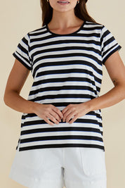 A model wearing the Caia Cotton Crew Tee in colour Stripe, from the front, cropped image