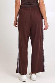 Model Madelinec wearing size 10 of the Nikki Relax Cotton Jogger – Chocolate in colour Chocolate, from the back