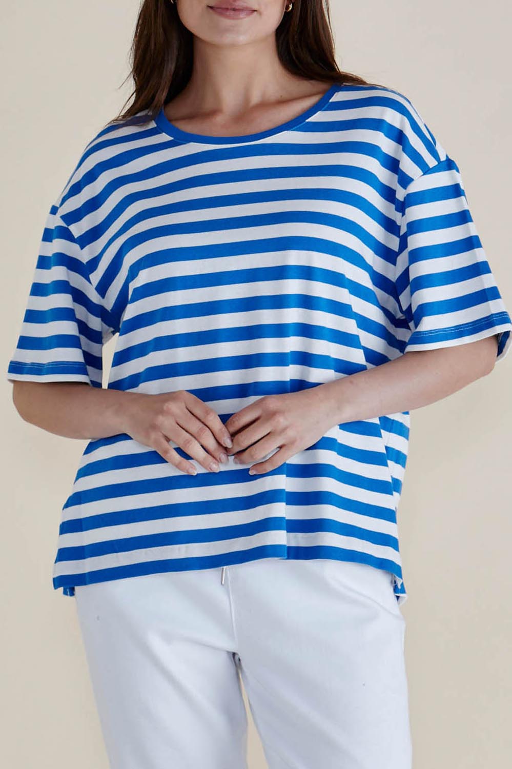 A model wearing the Relax Boxy Cotton Tee in colour Azureblue (Blue), from the front, cropped image