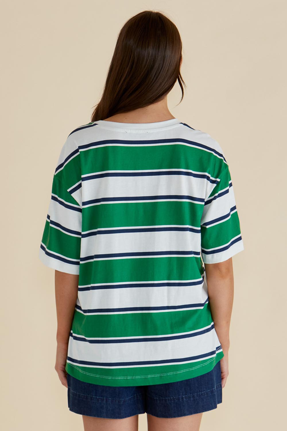 A model wearing the Relax Boxy Cotton Tee in colour Green (Green), from the back