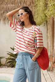 Model Genericm wearing size sample of the Relax Boxy Tee – Redwhite in colour Redwhite, from an angle