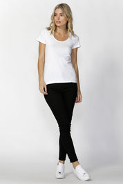 A model wearing the Brittany Tee in colour White (White), from the front, showing the whole outfit