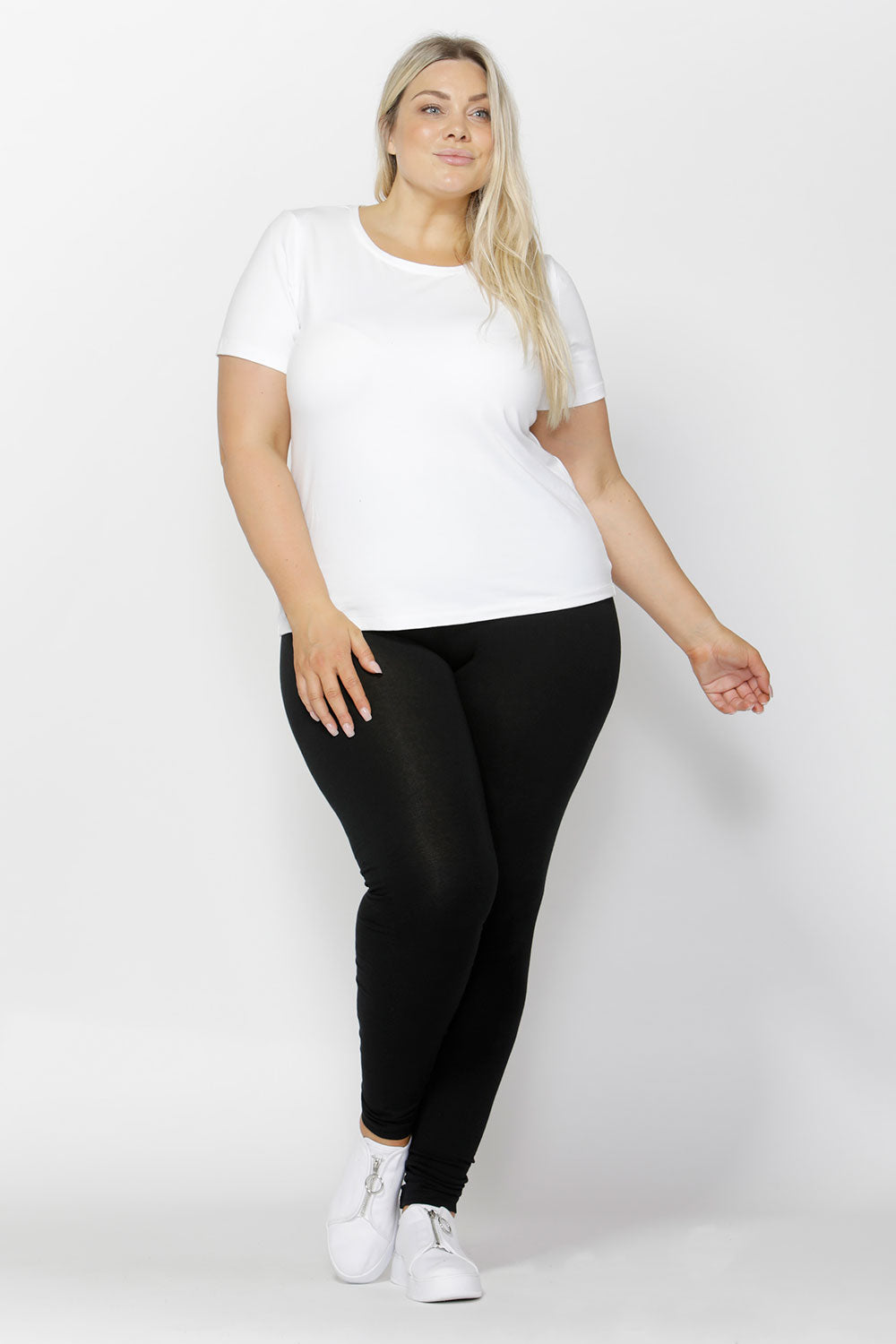 A model wearing the Brittany Tee in colour White (White), from the front, showing the whole outfit