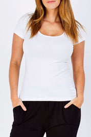 Model Laura wearing size 12 of the Brittany Tee in colour White (White), from the front, cropped image