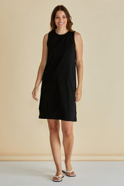 A model wearing the Tia Cotton Tank Dress in colour Black (Black), from the front, showing the whole outfit