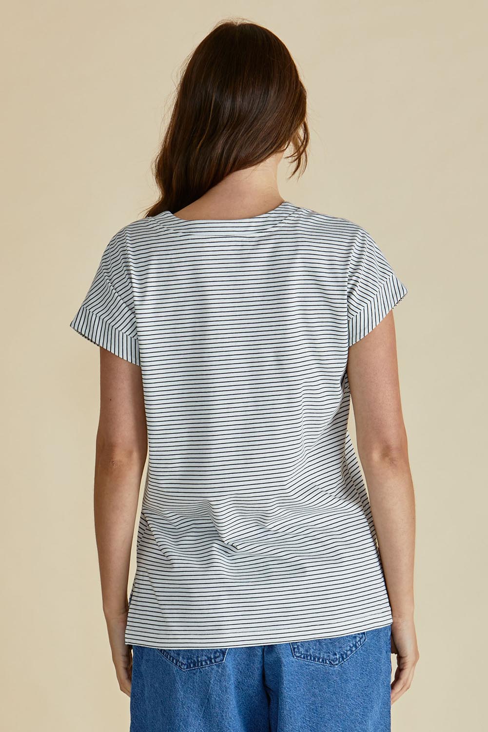 A model wearing the Tracy Vin colourNeck Cotton Tee - Blkwhite, from the back