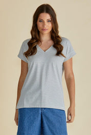 A model wearing the Tracy Vin colourNeck Cotton Tee - Blkwhite, from the front, cropped image