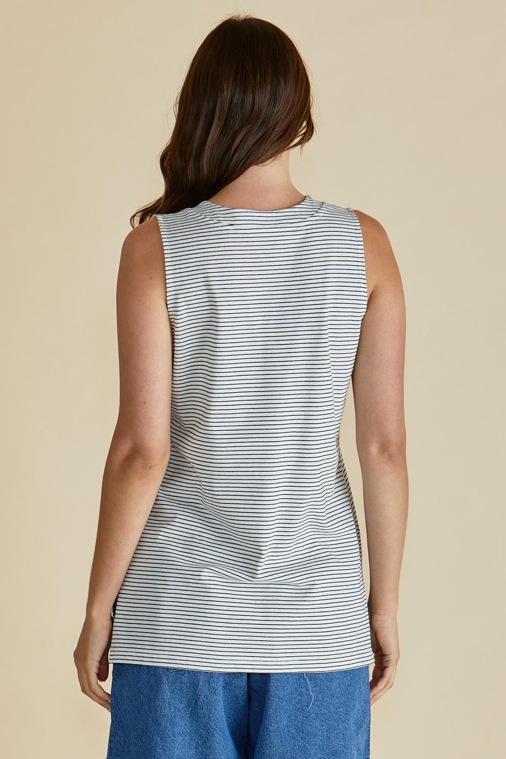 A model wearing the Trinity Vin colourNeck Cotton Tank - Blkwhite, from the back