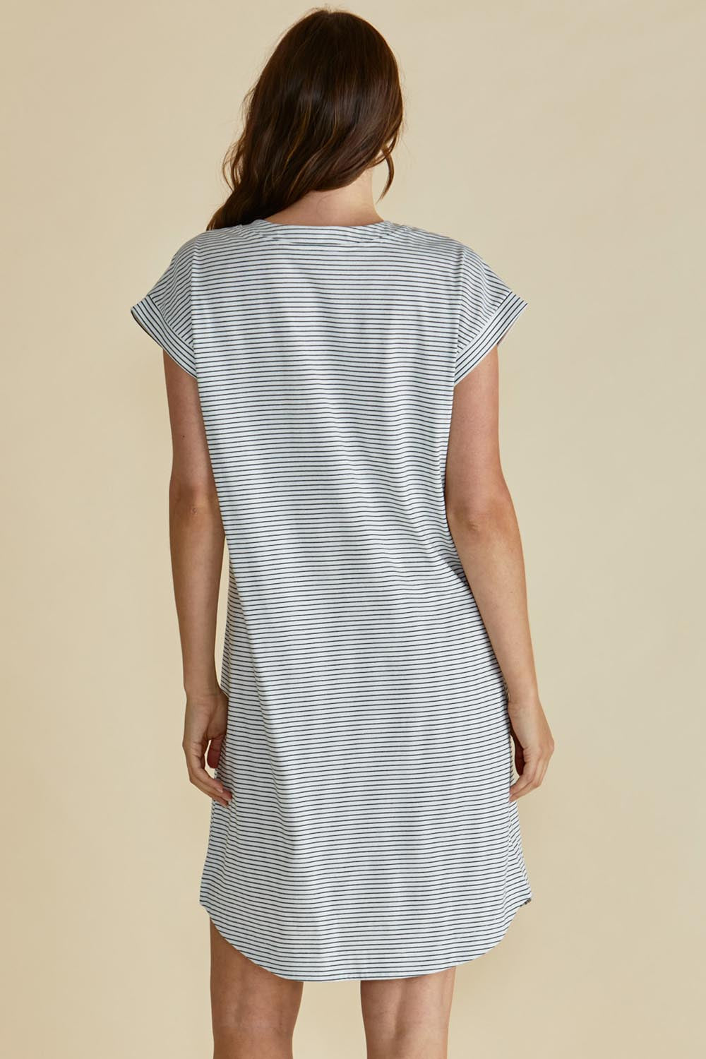 A model wearing the Daphne Vin colourNeck Cotton Dress - Blkwhite, from the back