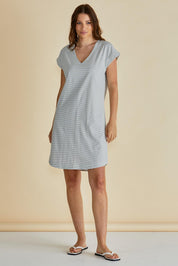 A model wearing the Daphne Vin colourNeck Cotton Dress - Blkwhite, from the front, showing the whole outfit