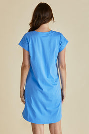 A model wearing the Daphne Vin colourNeck Cotton Dress - Powderblue (Blue), from the back