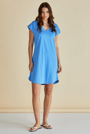A model wearing the Daphne Vin colourNeck Cotton Dress - Powderblue (Blue), from the front, showing the whole outfit