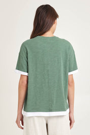 Model Madeline wearing size 10 of the Cotton Boyfriend Tee in colour Green (Green), from the back
