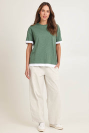 Model Madeline wearing size 10 of the Cotton Boyfriend Tee in colour Green (Green), from the front, showing the whole outfit