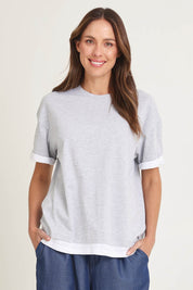 Model Madeline wearing size 10 of the Cotton Boyfriend Tee in colour Greymarle (Grey), from the front, cropped image