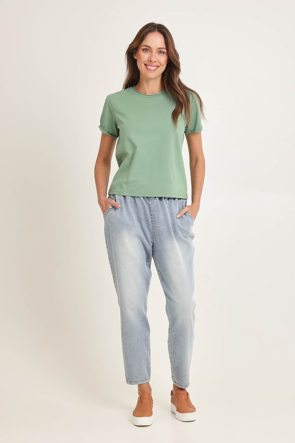 Model Madeline wearing size 10 of the Cotton Slim Fit Tee in colour Green (Green), from the front, showing the whole outfit