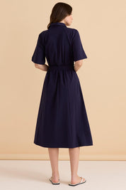 A model wearing the Rosalie Cotton Jersey Shirt Dress in colour Navy (Blue), from the back