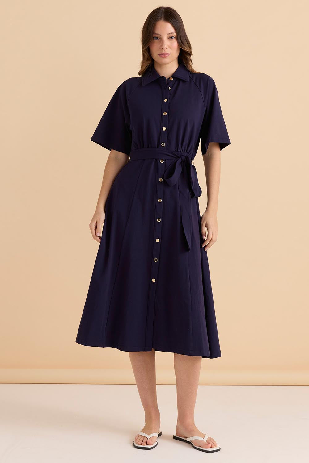 A model wearing the Rosalie Cotton Jersey Shirt Dress in colour Navy (Blue), from the front, showing the whole outfit