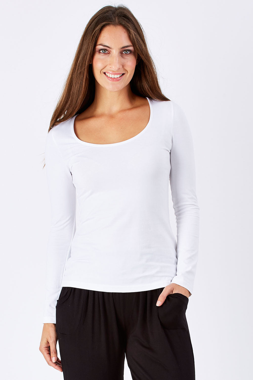 Model Anna wearing size 10 of the Madonna L/S Scoop Top in colour White (White), from the front, cropped image