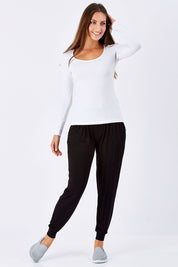 Model Anna wearing size 10 of the Madonna L/S Scoop Top in colour White (White), from the front, showing the whole outfit