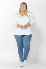 A model wearing the Madonna L/S Scoop Top in colour White (White), from the front, showing the whole outfit