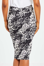 Model Olivia wearing size 10 of the Alicia Midi Skirt in colour Nala (Black), from the back